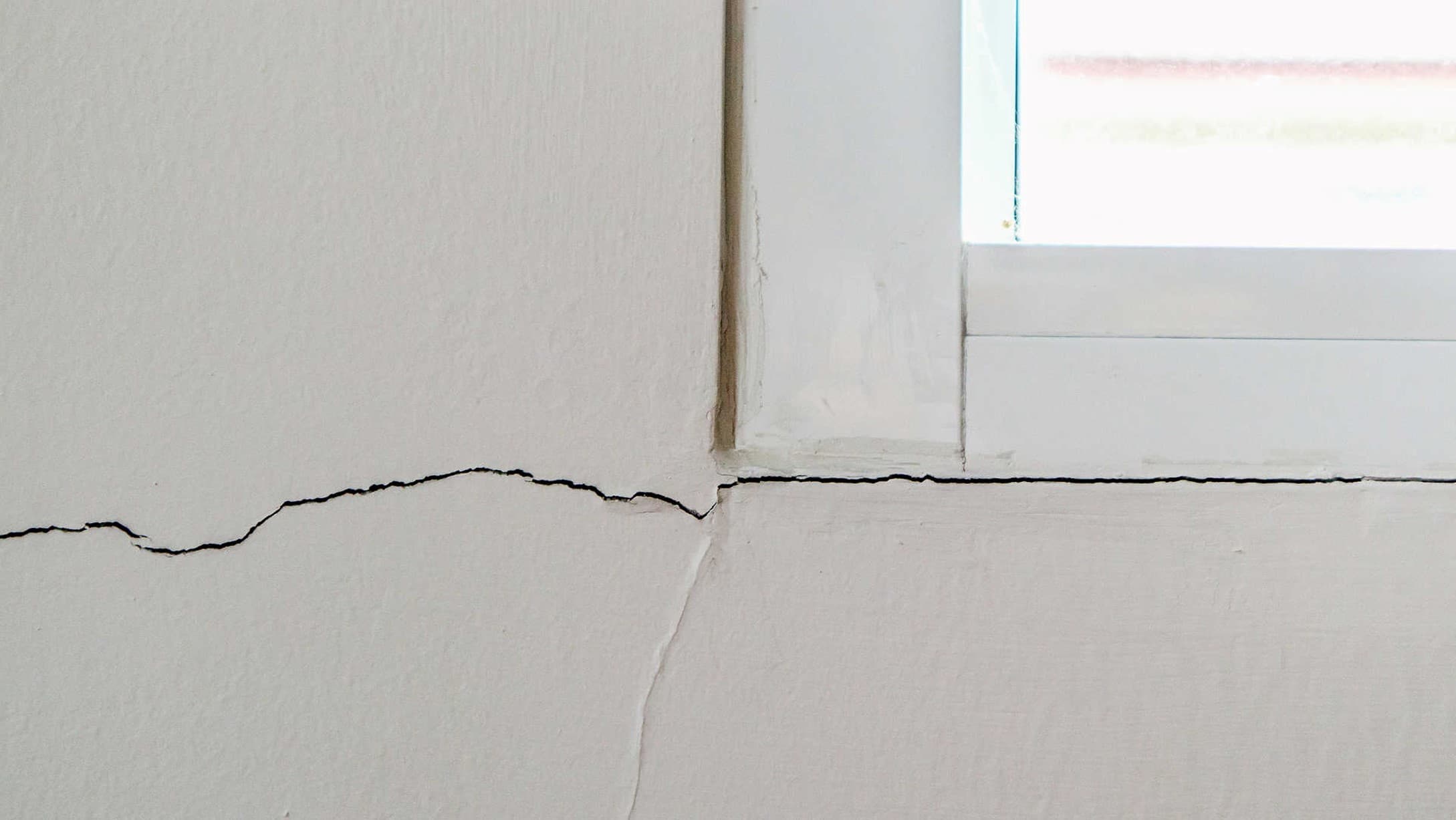 A crack running along a window, indicating first signs of foundation issues